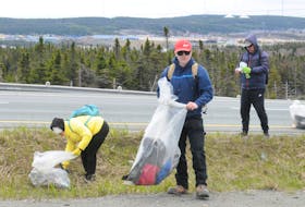 People help with the Outer Ring Road annual cleanup near the Team Gushue Highway exit ramps Sunday, May 28. JOE GIBBONS • THE TELEGRAM