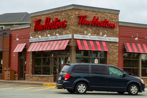A vehicle approaches the drive-thru at a Tim Hortons location in Halifax in April 2021.