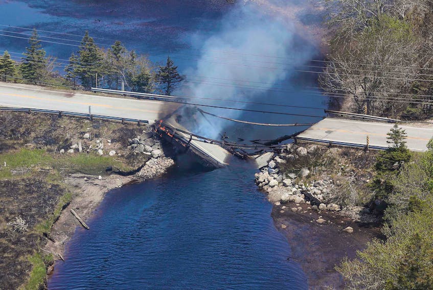 The collapsed bridge between Clyde River and Port Clyde smoulders. COMMUNICATIONS NOVA SCOTIA