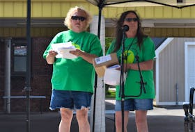 Lucas’ mom Laureen Rushton (left), who spearheaded the day to honour her son’s memory, and Colchester East Hants Canadian Mental Health Association executive director Susan Henderson draws for prizes near the conclusion of Sunday’s mental health awareness and fun event. Richard MacKenzie