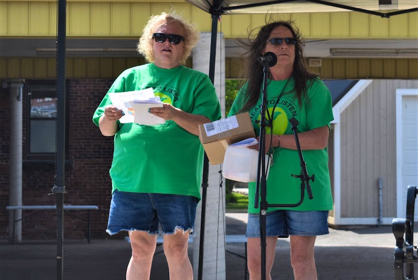Lucas’ mom Laureen Rushton (left), who spearheaded the day to honour her son’s memory, and Colchester East Hants Canadian Mental Health Association executive director Susan Henderson draws for prizes near the conclusion of Sunday’s mental health awareness and fun event. Richard MacKenzie