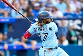 Vladimir Guerrero Jr. of the Blue Jays hits an RBI single against the Milwaukee Brewers at the Rogers Centre on May 30, 2023 in Toronto. 