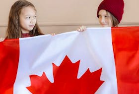 Young Canadians proudly display Canada's flag, our iconic symbol that is recognized and respected worldwide. Contributed