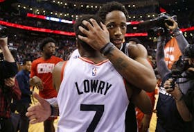 San Antonio Spurs' DeMar DeRozan hugs his former Toronto Raptors teammate  Kyle Lowry.