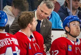 Canadiens head coach Martin St. Louis speaks with forward Chris Tierney during a game this year at the Bell Centre. “I’ve never been a guy that thinks he knows it all," St. Louis said on the Spittin' Chiclets podcast this week. 