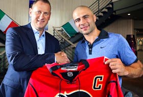 Mark Giordano and  Flames GM Brad Treliving speak to media on Mark's involvement with the Calgary Italian Open Charity Golf Tournament, which assists Italian-Canadians with educational resources in Calgary on September 2, 2015. 