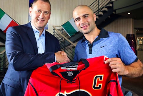 Mark Giordano and  Flames GM Brad Treliving speak to media on Mark's involvement with the Calgary Italian Open Charity Golf Tournament, which assists Italian-Canadians with educational resources in Calgary on September 2, 2015. 