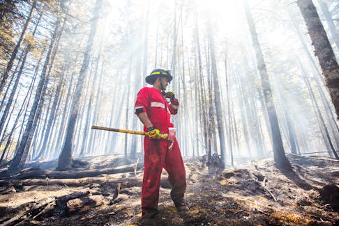 Halifax Regional Fire and Emergency firefighter Zach Rafuse from Port Williams works to put out fires in the Tantallon area. COMMUNICATIONS NOVA SCOTIA