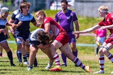 Conception Bay South teen James Noftall (centre) is heading to the Netherlands this summer with the Canadian under-18 rugby team. Contributed photo