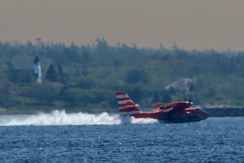 A water bomber lands for another load near Sandy Point, NS, seen from Shelburne June 1, 2023.

TIM KROCHAK PHOTO