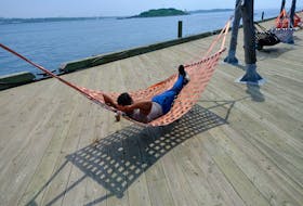 FOR NEWS STORY:
Some prefer the full heat of the sun, some prefer a cool breeze next to the harbour in a hammock in Halifax Monday June 7, 2021. 