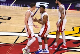 Heat players Duncan Robinson, left, and Kyle Lowry, centre, react during fourth quarter action against the Nuggets in Game Four of the 2023 NBA Finals at Kaseya Center in Miami, Friday, June 9, 2023.