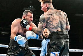 Ryan Rozicki lands a left hook on Zamig Atakishiyev of Azerbaijan during a heavyweight bout Saturday night at the Halifax Forum. The Sydney Forks boxer after scoring a third-round TKO. - Jeff Lockhart Photo