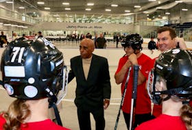 Following the unveiling of the John Paris Jr. Rink sign on June 9, the 76-year-old hockey legend gave some pointers before a celebrity ball hockey tournament. Pictured to Paris' left are West Hants Mayor Abraham Zebian and Kings-Hants MP Kody Blois.