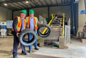 MMSB Chair Derm Flynn (left) and The Honourable Bernard Davis, Minister of Environment and Climate Change (right) pose at the opening of Newfoundland and Labrador’s first tire recycling facility. PHOTO CREDIT: Contributed