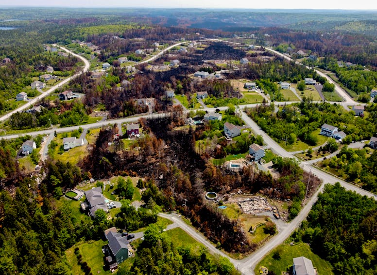 FOR FILE:
An aerial view of the destruction in Westwood Hills subdivision in Upper Tantallon, following the recent wildfire,  Tuesday June 13, 2023. At lower right is 25 Juneberry Lane where the first call for the fire came from.

TIM KROCHAK PHOTO