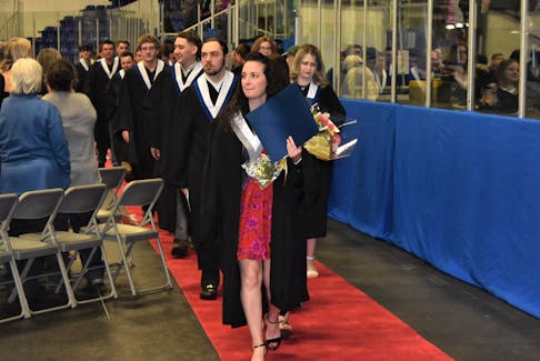 Certificate in continuing care graduate Aylin Cikla, from New Glasgow, leads a procession line out of the Sobey Arena following the ceremony. Richard MacKenzie