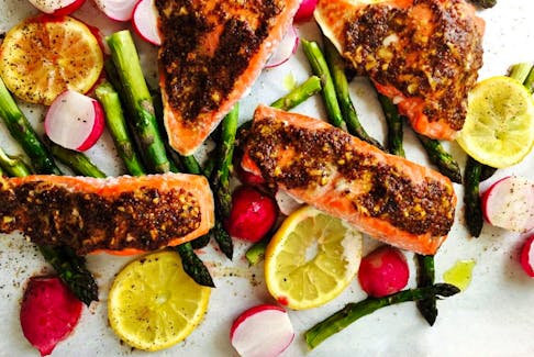 Mustard-crusted salmon with roasted radishes and asparagus is a spring treat. Photo by Renee Kohlman.