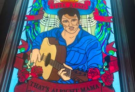 The new Elvis Presley-themed stained glass window, created by SGO Designer Glass, inside Mom's Little White Chapel in Mobile.