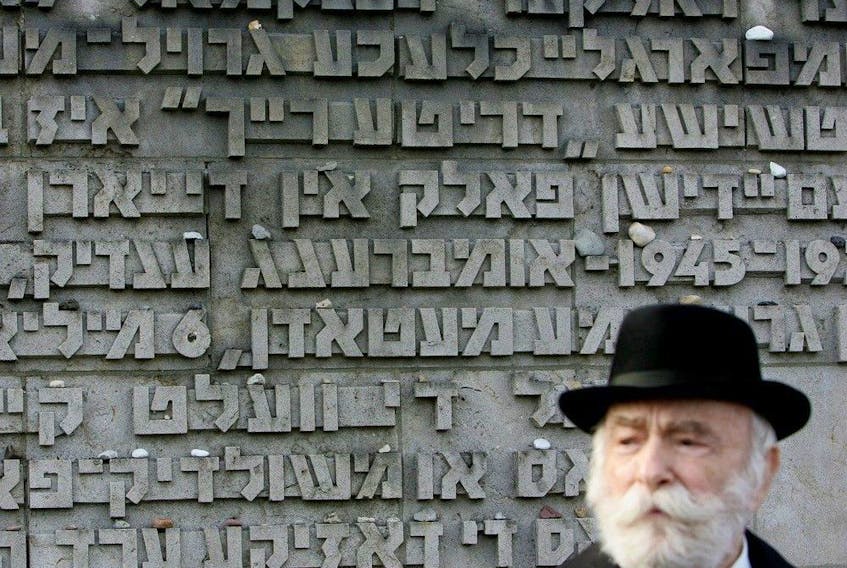  Moshe Kraus, a survivor of the Bergen-Belsen concentration camp during the Second World War, stands outside the Bergen-Belsen Memorial before it was officially opened in October 2007.
