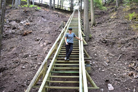 Tammy Hovey stands about 12 stairs up on Jacob’s Ladder which reopened at the first of the month after town crews worked on it last month. The ladder was severely damaged by Hurricane Fiona last September. Richard MacKenzie