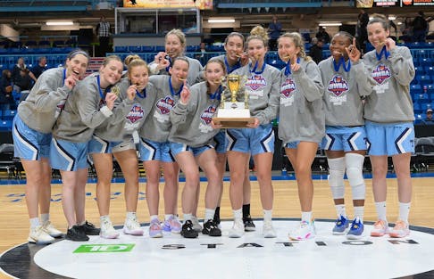 Halifax Thunder players pose with the Legacy Cup after winning the Maritime Women's Basketball Association championship on Sunday in Saint John. - David Gallant