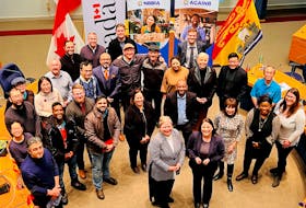 Members of the New Brunswick Business Immigrants Association and supporters are shown at Fredericton City Hall during a January ACOA funding announcement. Contributed