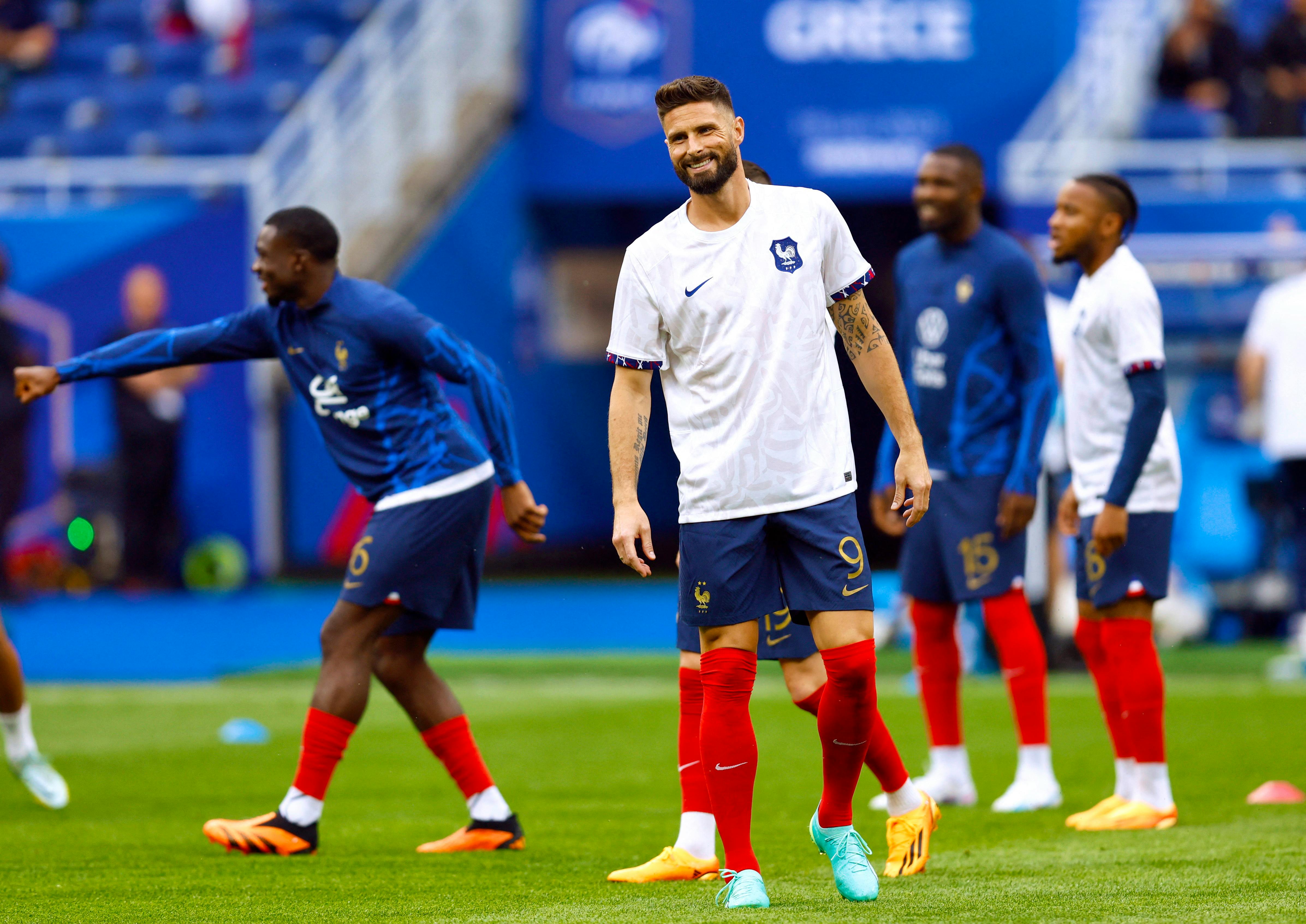 Soccer-French men warm up for Greece game wearing women's shirts