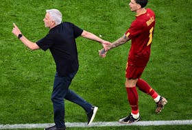 AS Roma's Portuguese coach Jose Mourinho (L) reacts to the injury of AS Roma's Brazilian defender Roger Ibanez during the UEFA Europa League final football match between Sevilla FC and AS Roma at the Puskas Arena in Budapest on May 31, 2023. 