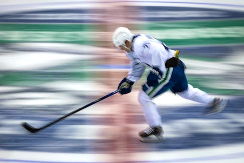 Vancouver Canucks' Nils Hoglander, of Sweden, skates during the NHL hockey team's training camp in Abbotsford, B.C., on Thursday, September 23, 2021.