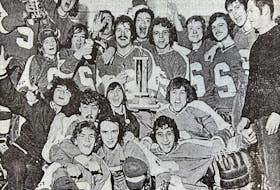 Members of the 1974-75 Sydney Academy boys’ hockey team celebrate after winning their third consecutive Cape Breton Metros Invitational Hockey Tournament in November 1974 in Sydney. The team will be inducted into the Cape Breton Sport Hall of Fame this weekend. CONTRIBUTED