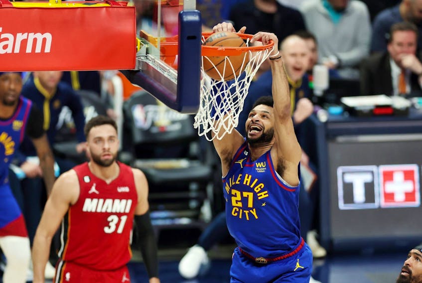 Jamal Murray of the Denver Nuggets dunks during the first quarter against the Miami Heat in Game 1 of the 2023 NBA Finals at Ball Arena on June 1, 2023 in Denver.