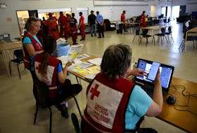 Red Cross volunteers are seen at the relief center, set up in the auditorium of the Shelburne Fire Hall Thursday June 1, 2023. Several forced from their homes due to the nearby wildfire were staying there.

TIM KROCHAK PHOTO