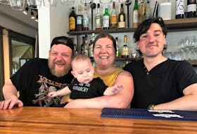 Chef Josh Butts poses with Mary Stewart and Kevin Johnson who manage The Monarch, a marina and restaurant on Riverside Street, New Glasgow. Stewart and Johnson’s son, Tobias, spends a lot of time at the restaurant, just handing out. Rosalie MacEachern