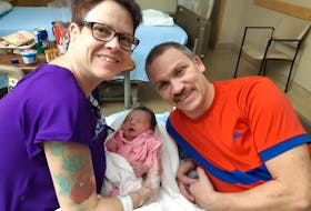 Alexis Chisholm from Long Point, N.S., with her husband Lawrence and baby Emma, who Alexis carried as a surrogate mother for a couple in France. Contributed
