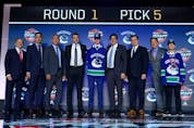  Elias Pettersson poses for photos after being selected fifth overall by the Vancouver Canucks during the 2017 NHL Draft at the United Center on June 23, 2017 in Chicago, Illinois.