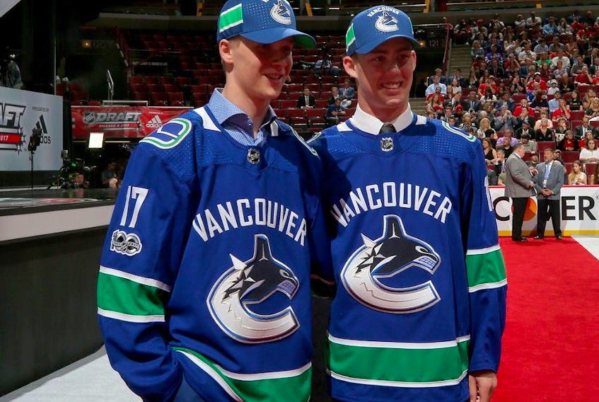  Elias Pettersson, left, and Kole Lind pose for photos after being drafted by the Vancouver Canucks during the 2017 NHL Draft at the United Center on June 24, 2017 in Chicago, Illinois.