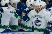  Vancouver Canucks Jonah Gadjovich celebrates with the team after scoring against the Winnipeg Jets during NHL preseason hockey action at the Young Stars Classic held at the South Okanagan Events Centre in Penticton, BC, September, 8, 2017.