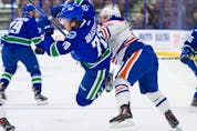  Edmonton Oilers Trey Fix-Wolansky (right) hits Vancouver Canucks Matt Brassard during NHL preseason hockey action at the Young Stars Classic held at the South Okanagan Events Centre in Penticton, BC, September, 11, 2017.