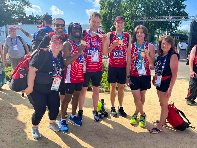 P.E.I.’s Jeremy Wall, fourth from right, displays the bronze medal he won as part of Team Canada’s 4x100-metre relay team at the Special Olympics World Games on June 24. Wall completed the athletics’ competition at the World Games with three medals – one gold and two bronze. Special Olympics P.E.I. • Special to The Guardian