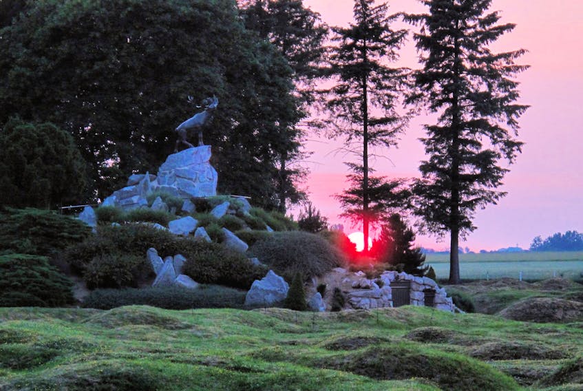 Dusk at Beaumont-Hamel in France, where the bronze caribou statue stands — the largest and most-visited of five Newfoundland memorial sites in France and Belgium. Contributed