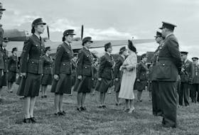 The RCAF Women's Division, being inspected at Leeming in the UK by His Majesty King George VI and Queen Elizabeth (the Queen Mother). An RCAF Handley Page Halifax is in the background - as seen during the Royal visit, 11 Aug 1944. Photographer unknown. Library and Archives Canada.