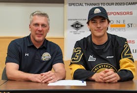 Charlottetown Islanders general manager and head coach Jim Hulton, left, and Owen Conrad are all smiles after the team’s first pick in 2023 signed for the upcoming Quebec Major Junior Hockey League (QMJHL) season. Charlottetown Islanders • Special to The Guardian