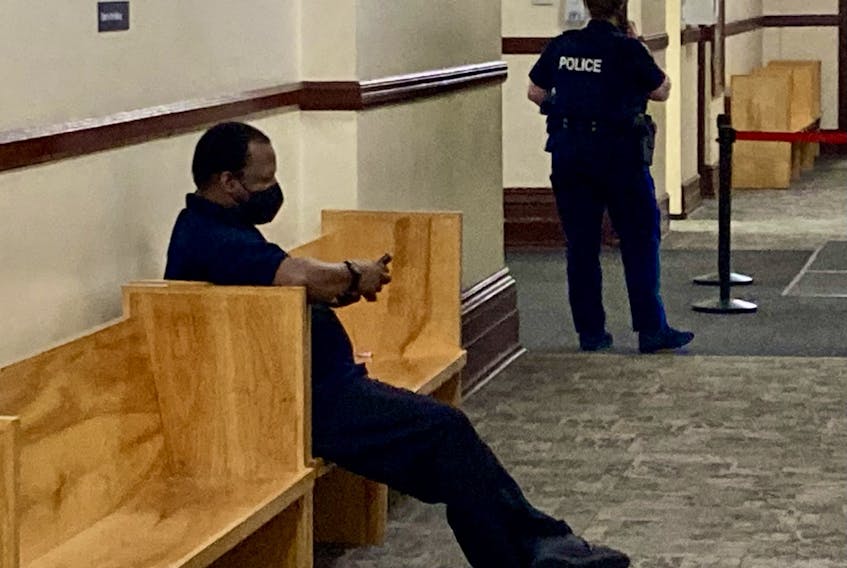 Renaldo Antonio Lewis, a former cable TV installer, is shown in a hallway at Halifax provincial court prior to his recent sentencing for assaulting a woman in her home in October 2020.