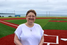 Lisa McNeil-Campbell, chairperson for the Hawks Dream Field, stands near home plate on the refurbished Hawks Dream Field in Dominion on Wednesday. The grand opening of the multimillion-dollar baseball field will take place on Sunday, beginning at 11 a.m. EMILY CONOHAN/SPECIAL TO THE CAPE BRETON POST
