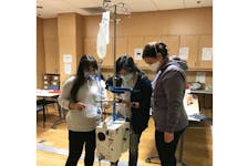 From left to right: QEII registered nurses Noelle Ozog, Xiaoqi Zhu and Heather Parsons receive training on the new Belmont Rapid Infuser system in the QEII Emergency and Trauma Centre. PHOTO CREDIT: Contributed
