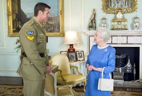 FILE PHOTO: Britain's Queen Elizabeth II greets Australian SAS Corporal Ben Roberts-Smith, who had recently been awarded the Victoria Cross for Australia, during an audience at Buckingham Palace in London November 15, 2011.  REUTERS/Anthony Devlin/POOL/File Photo  Britain's Queen Elizabeth II greets Australian Special Air Service Cpl. Ben Roberts-Smith, who had recently been awarded the Victoria Cross for Australia, during an audience at Buckingham Palace in London on Nov. 15, 2011. Last week, an Australian civil court agreed there was enough evidence that Roberts-Smith likely committed atrocities while serving in Afghanistan. REUTERS file/Anthony Devlin/POOL
