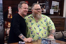Warren Brophy of St. John’s poses for a photo with actor Kiefer Sutherland during a promotional signing of bottles of his Red Bank Whisky in St. John’s Monday afternoon. Brophy has a tattoo of Sutherland’s character from the movie “The Lost Boys” on his left forearm. Keith Gosse • The Telegram
