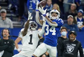 Indianapolis Colts cornerback Isaiah Rodgers intercepts a pass intended for Las Vegas Raiders wide receiver DeSean Jackson in 2022.