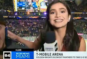 Miami TV reporter Samantha Rivera fends off an unruly fan in Las Vegas on Monday night.